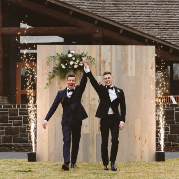 two wedding participants walking down the aisle