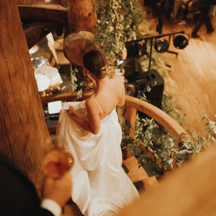 bride walking down the stairs at a wedding